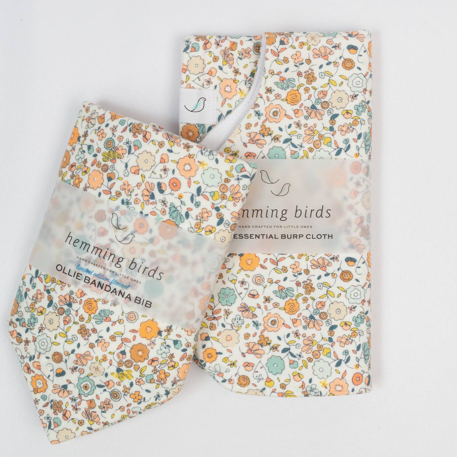 Floral patterned baby bib on a white background