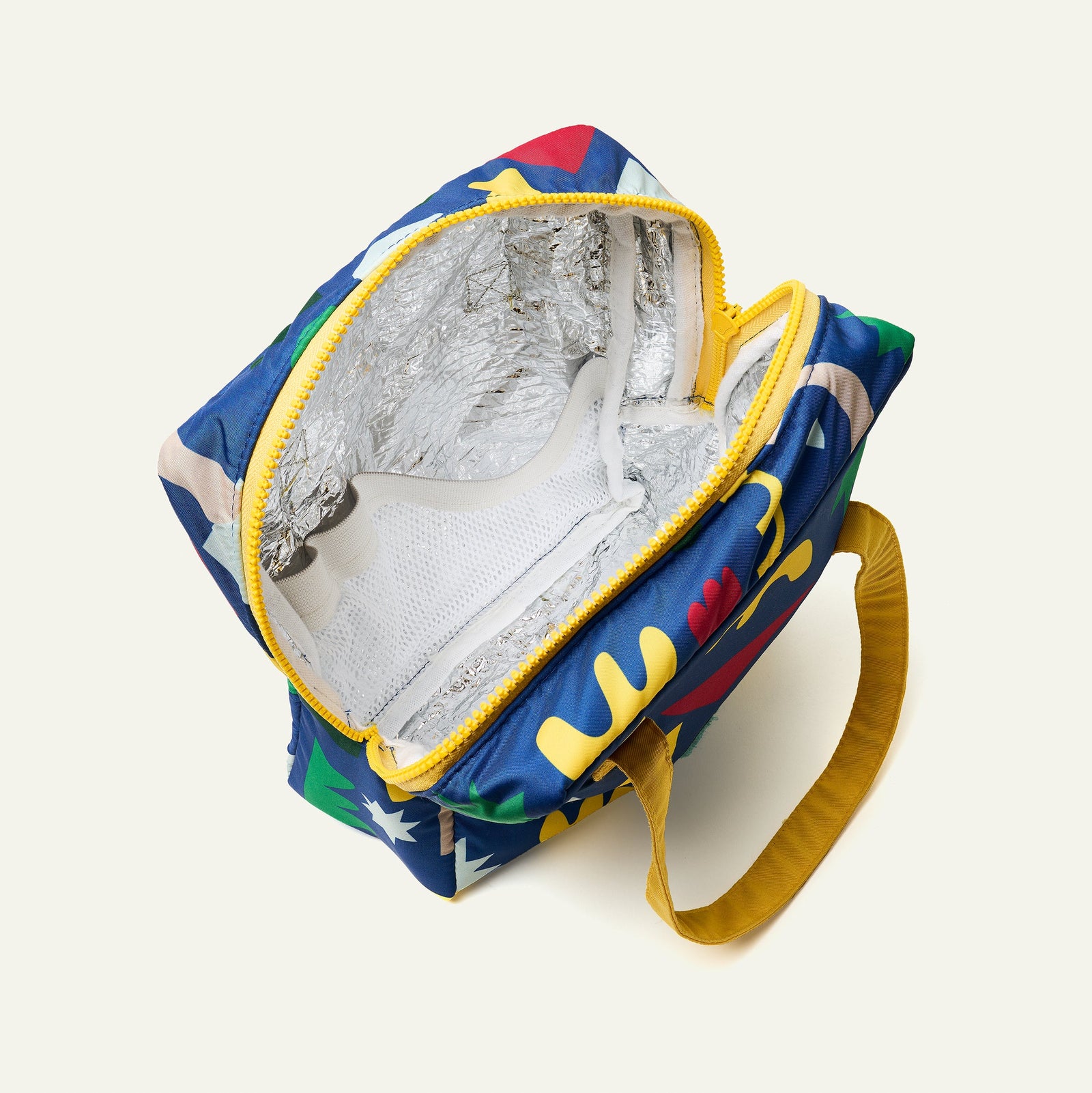 Colorful lunch bag with geometric patterns on a white background