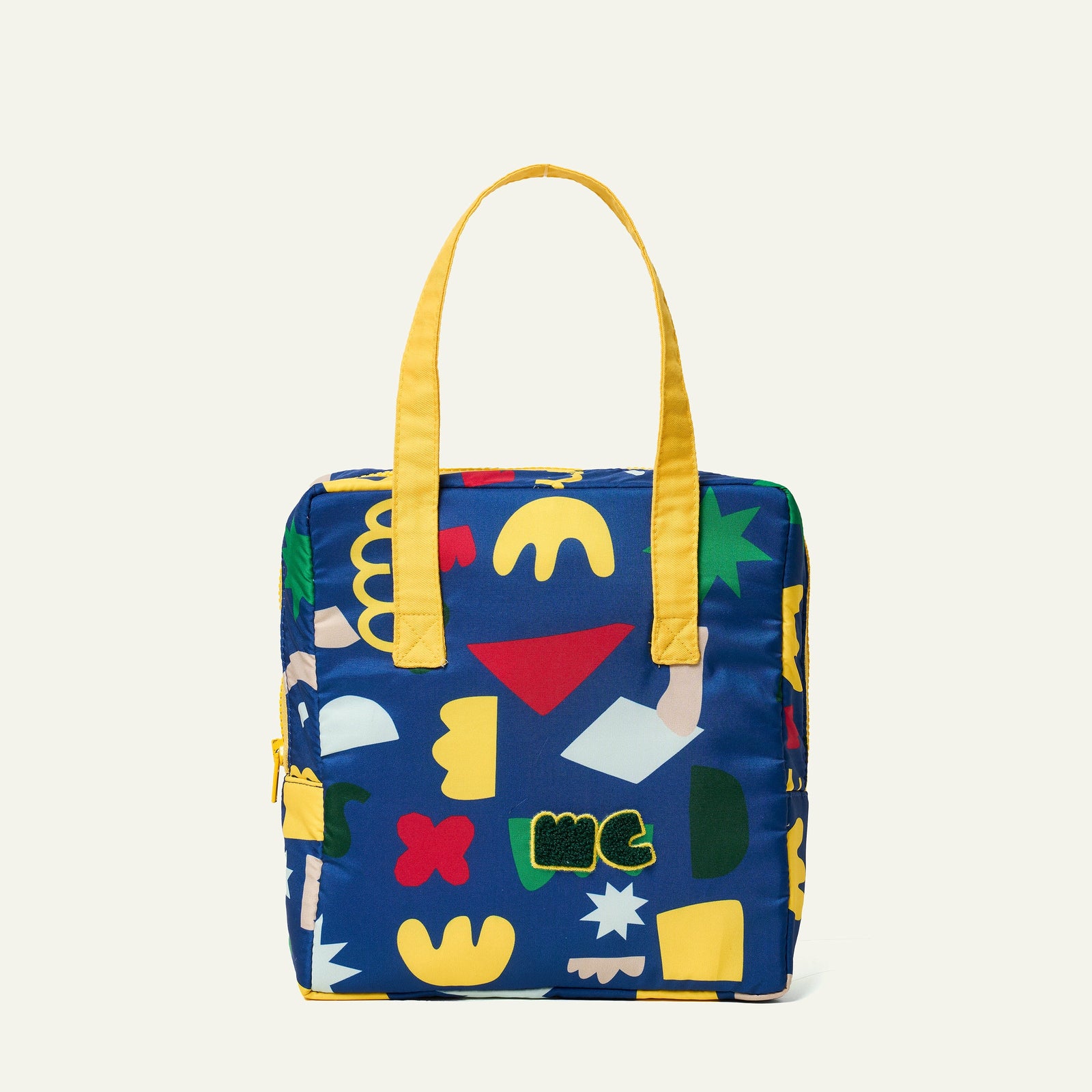 Colorful lunch bag with geometric patterns on a white background