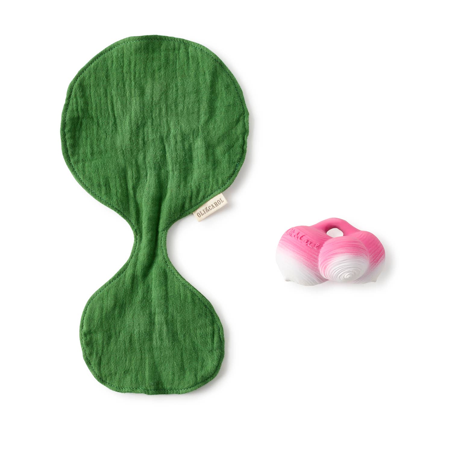Green leaf-shaped toy with a pink base on a white background