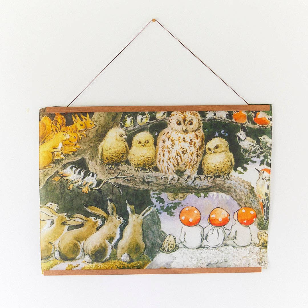 A square art print  featuring a whimsical woodland illustration with an owl, rabbits, squirrels, birds, mushrooms, and three figures with orange mushroom-shaped heads, shown against a plain white background.