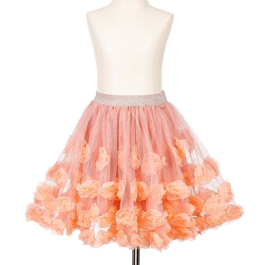 Peach-colored tulle skirt with floral details on a mannequin against a white background