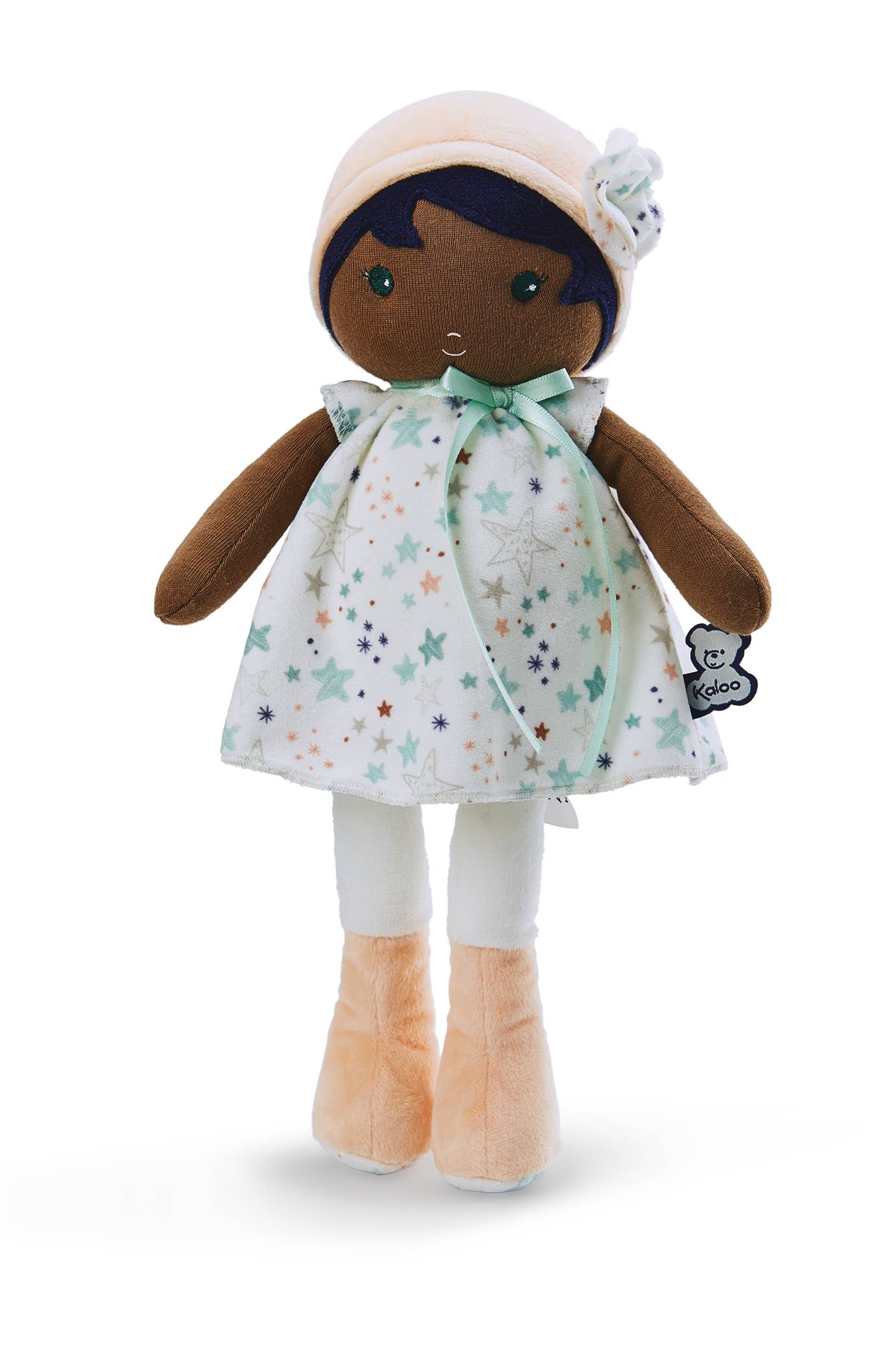Stuffed doll with a star-patterned dress on a white background