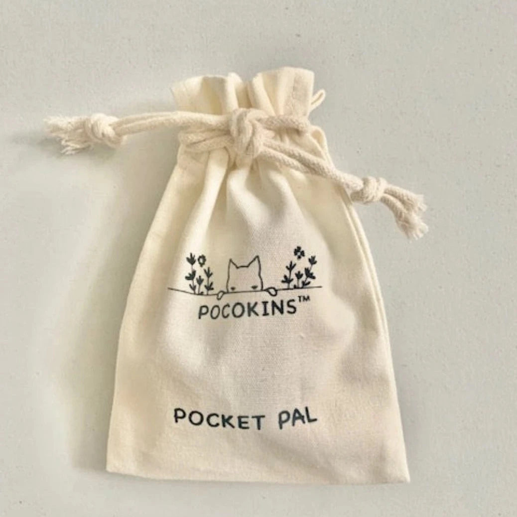 An off-white cotton drawstring pouch with a black printed logo and text reading 'POCKINS' and 'POCKET PAL' on a light gray background.