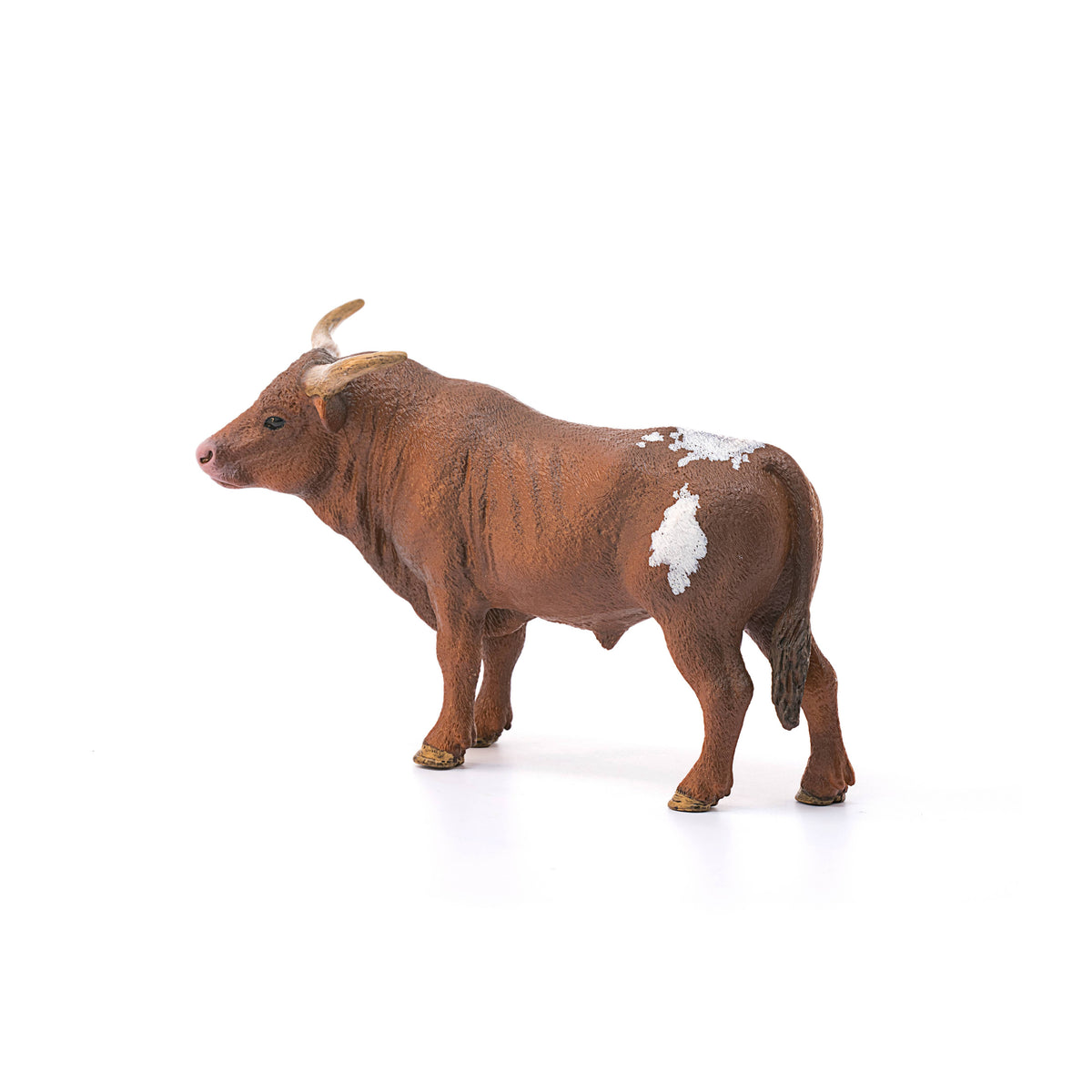 Brown bull figurine with white markings on a white background