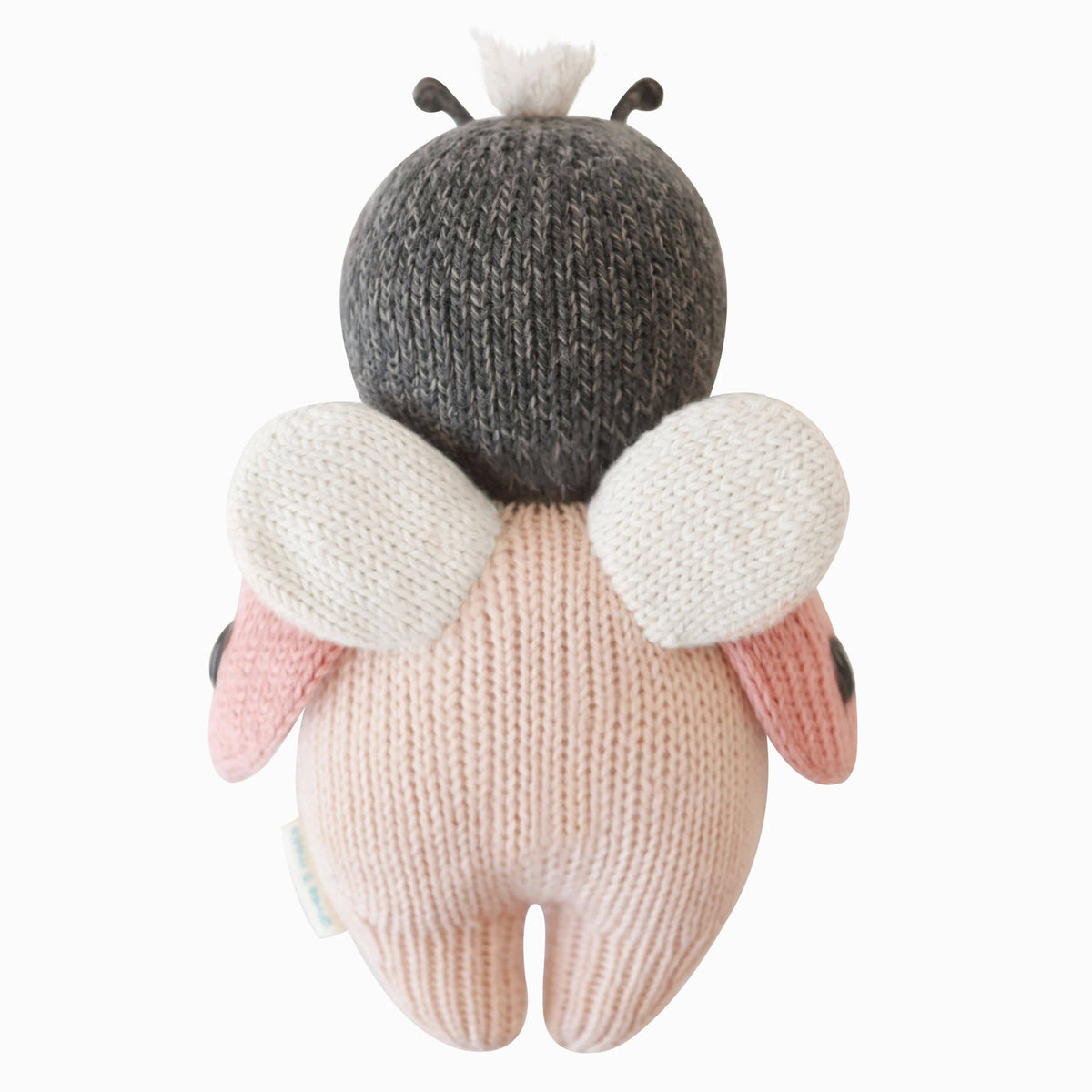 Knitted bee toy with a white background