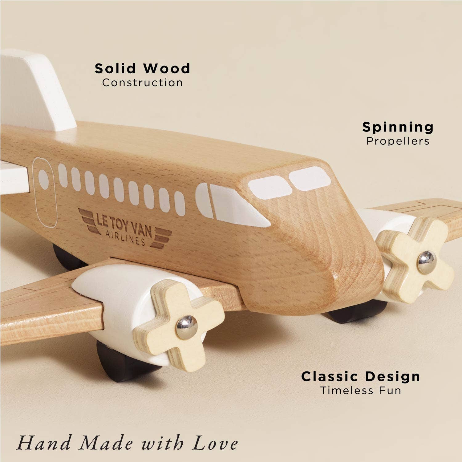 Wooden airplane toy with propellers on a white background