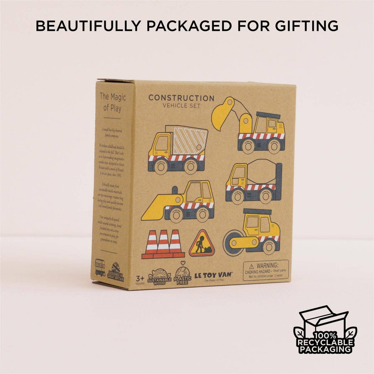 Cardboard box packaging for a construction vehicle set with illustrations of vehicles on a beige background.