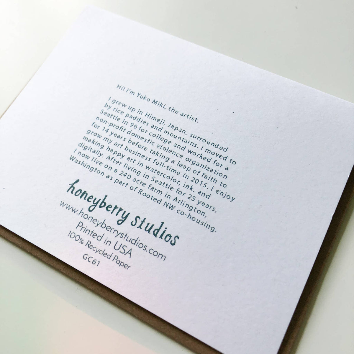 Letterpress printed card with text and honeyberry studios branding on a white background