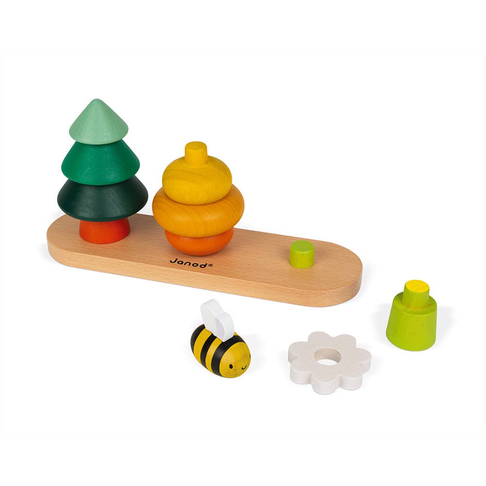 Set of colorful wooden toys including trees, a bee, and flowers on a white background