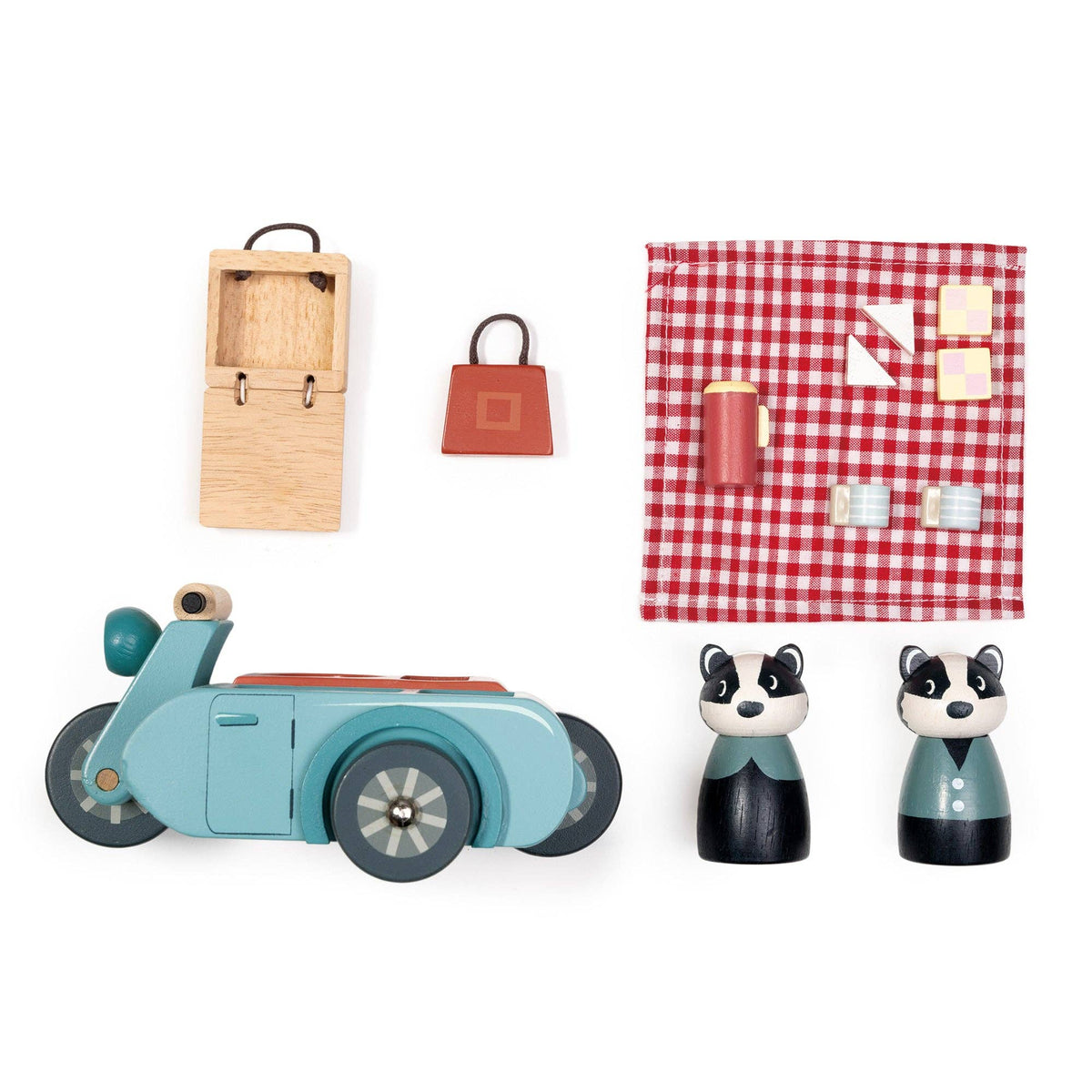 Collection of wooden toys including a scooter, bags, and animal figures on a white background.