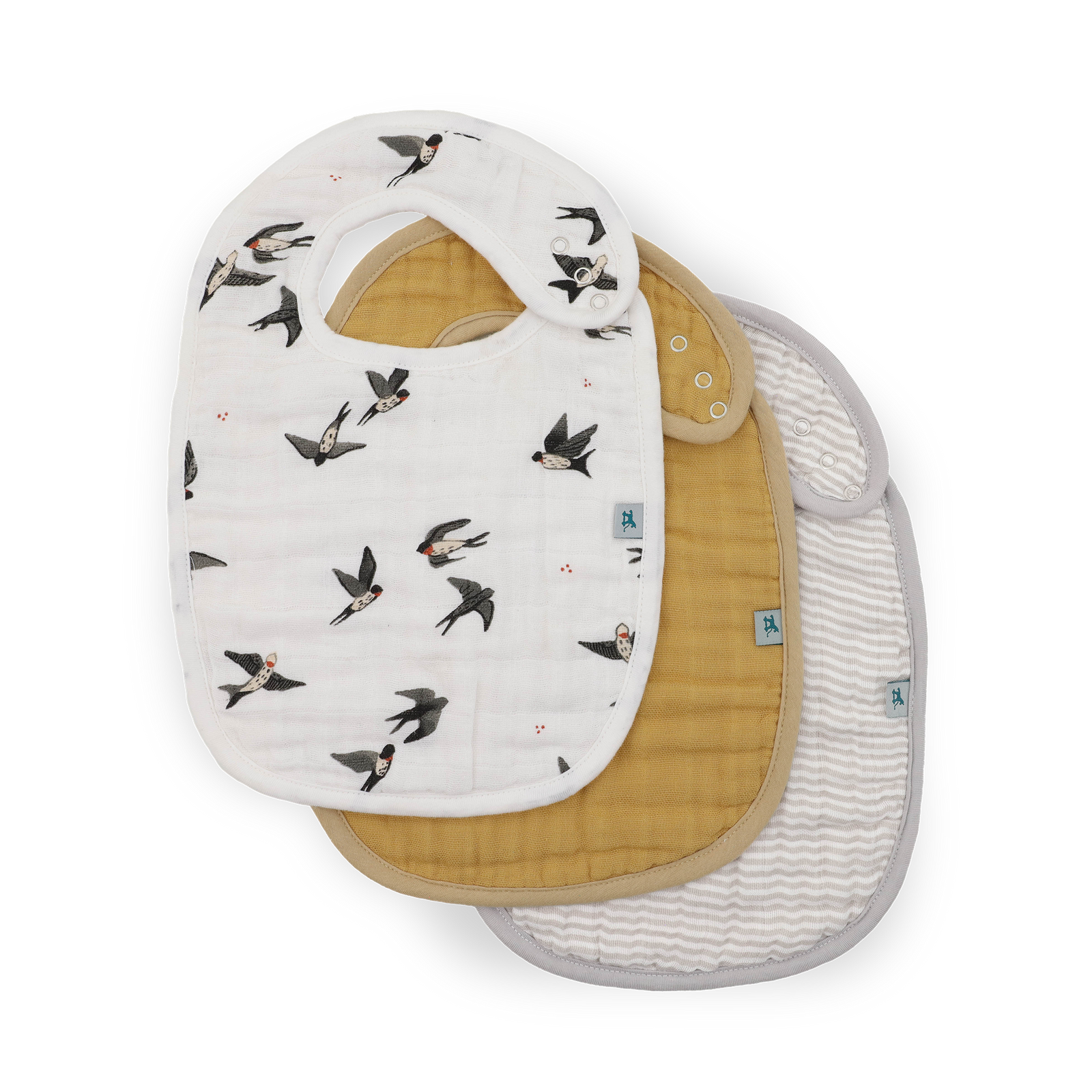 Three muslin baby bibs stacked on a white background. The top bib is white with a print of small birds.