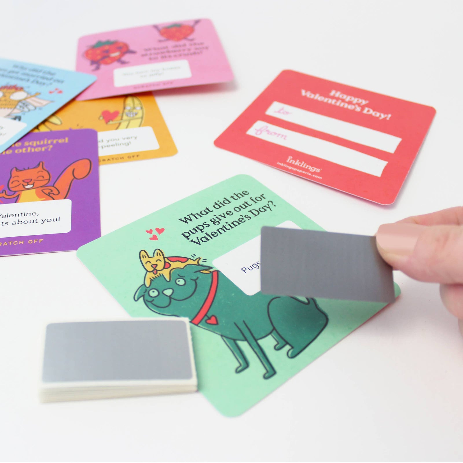 Collection of Valentine's Day scratch-off cards on a white background