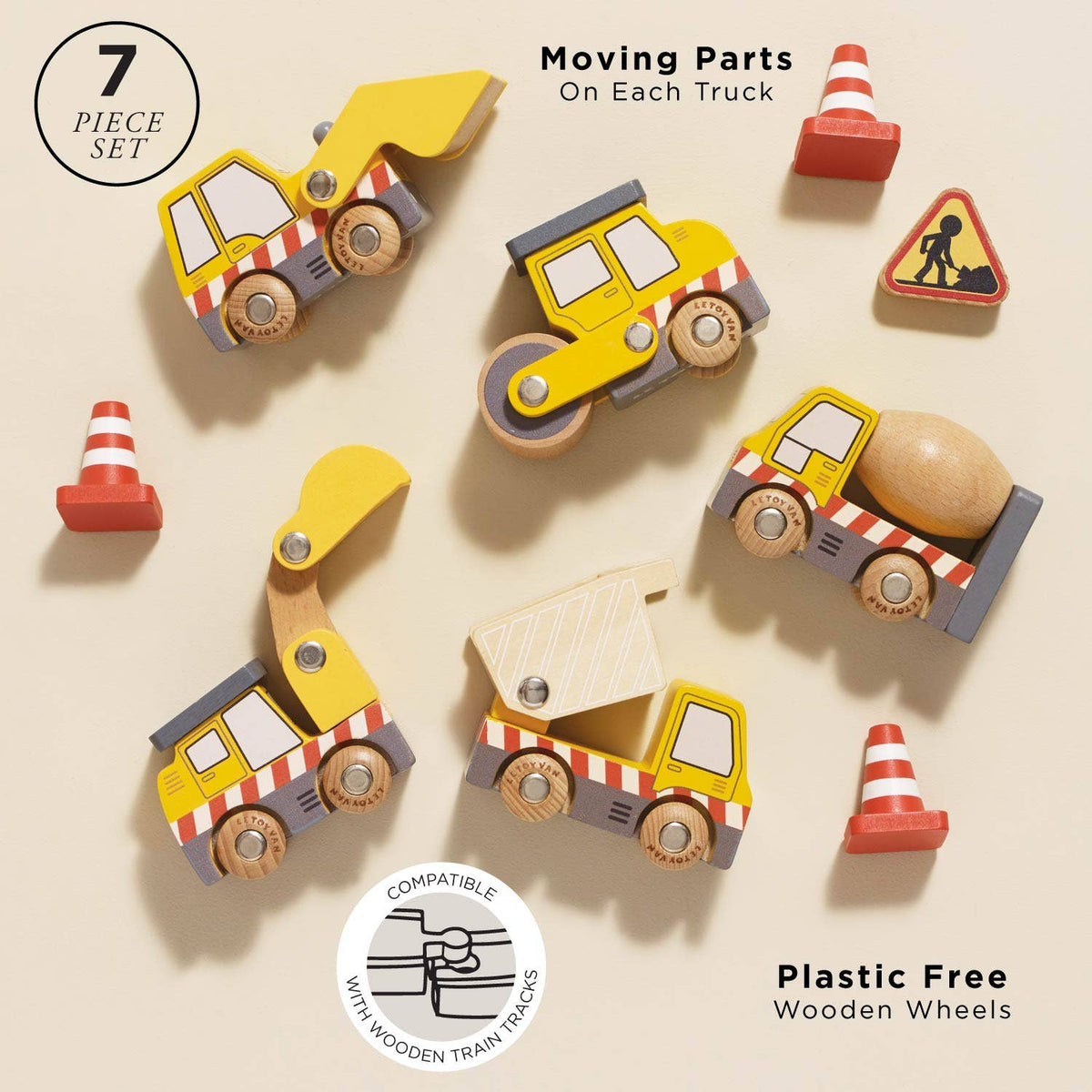 Set of wooden toy trucks with moving parts on a beige background
