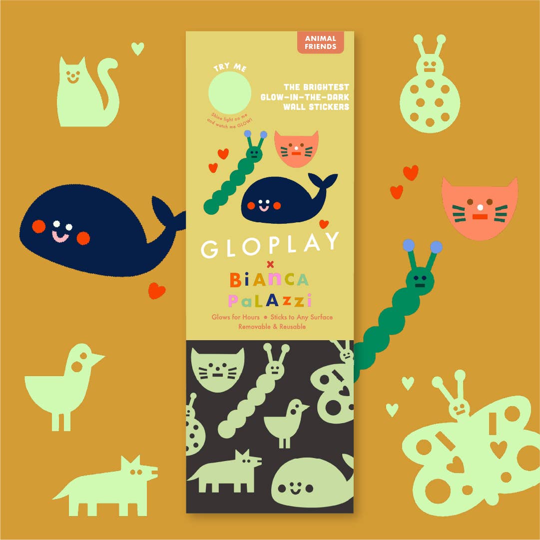 GloPlay and Bianca Palazzi wall stickers packaging with glow-in-the-dark animals on a mustard background.