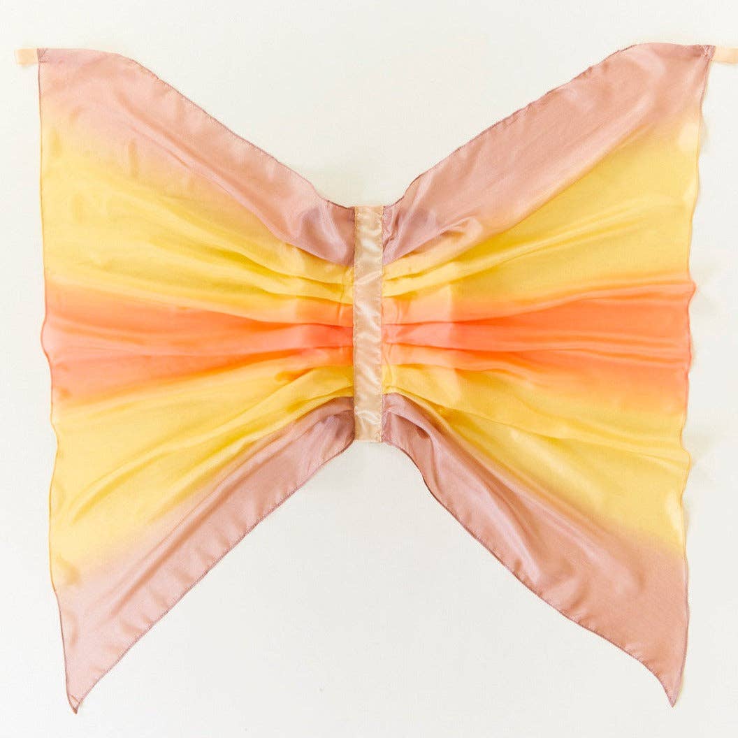 Butterfly-shaped wingswith a gradient of pink, orange, and yellow on a white background