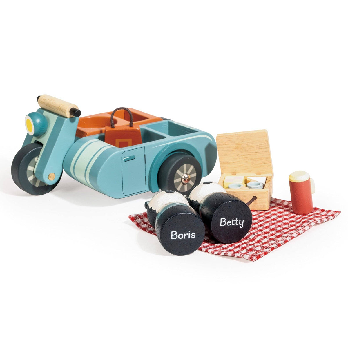 Toy scooter with picnic basket and duffel bags on a white background
