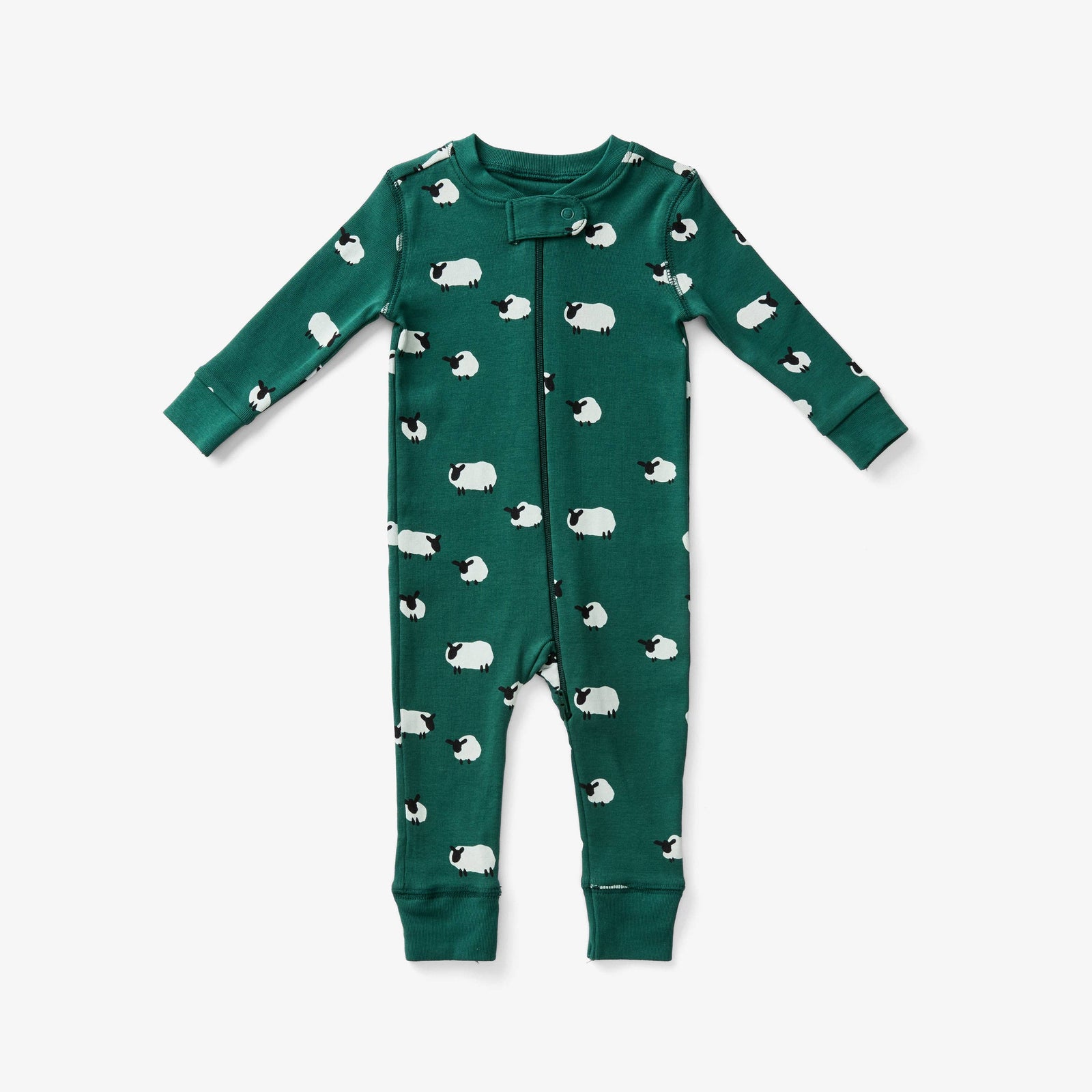 A long-sleeve baby pajama in dark green, featuring an all-over print of white sheep with black faces. The front has a zipper and ribbed cuffs and hem, shown flat on a light gray background.