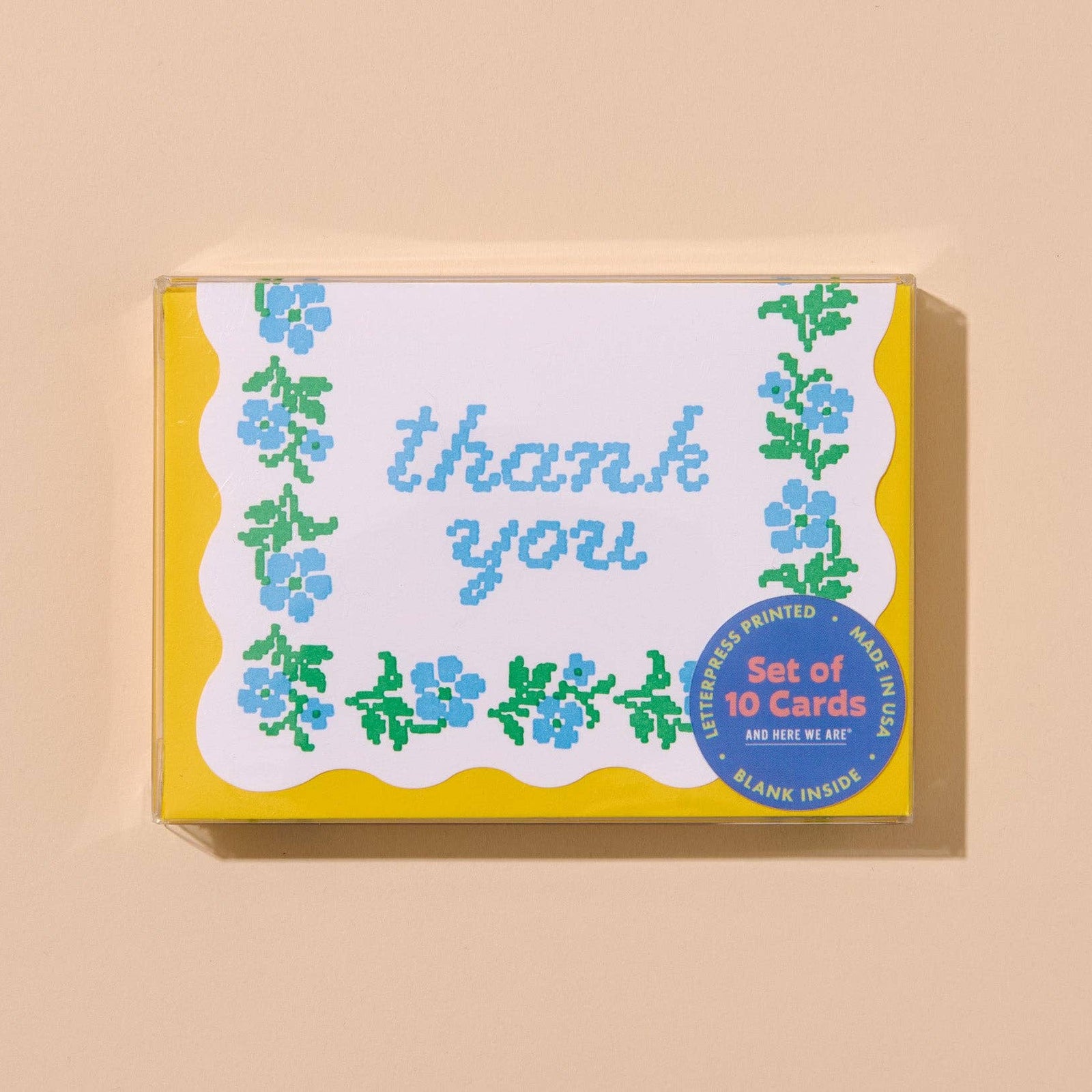Set of 'thank you' cards with floral designs and yellow borders.