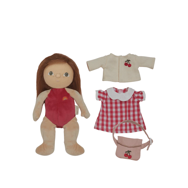 Doll with red suit and accessories on a white background