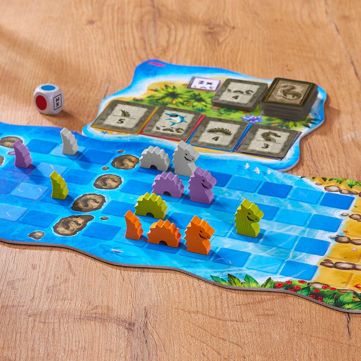 Board game with colorful dragon figures on a wooden surface