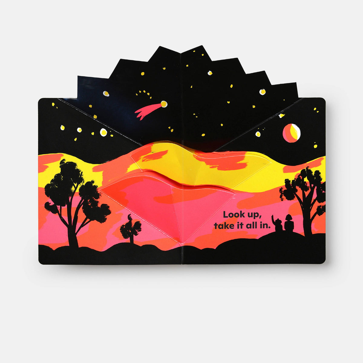 Stack of paper cutout cards with a sunset design and text on a white background