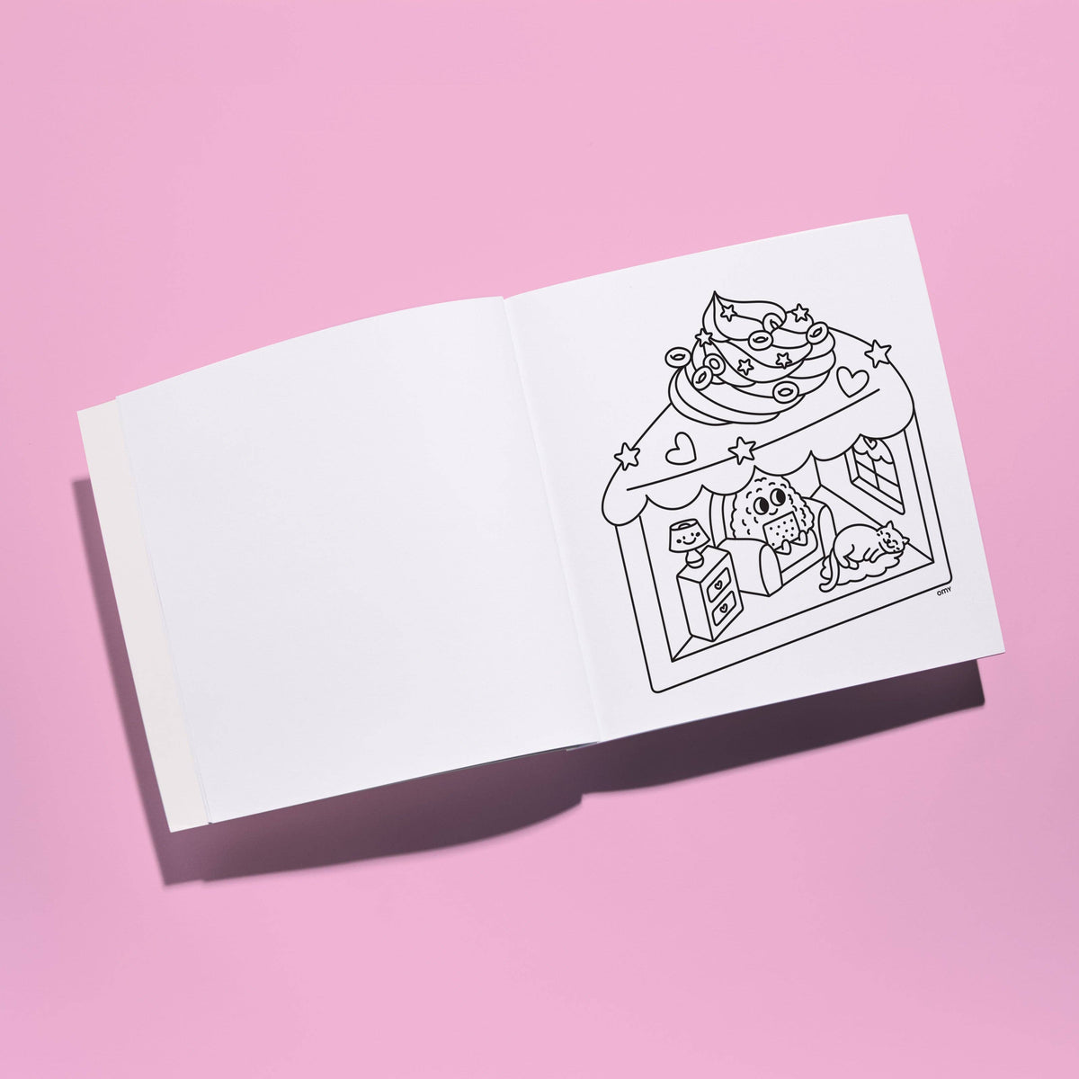 White card with black line art of a cake and gift box on a pink background