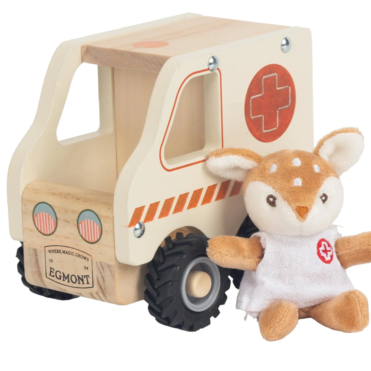 A wooden toy ambulance with a plush deer doll dressed as an ambulance worker sitting beside it, photographed on a clean white background.
