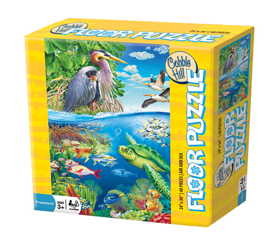 Cobble Hill puzzle box with colorful illustration of birds and marine life on a white background