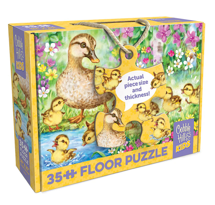 Floor puzzle packaging with ducks and chicks illustration on a colorful box