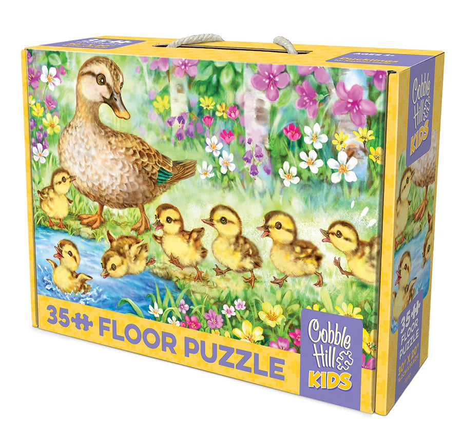 Floor puzzle packaging with ducks and chicks illustration on a colorful box