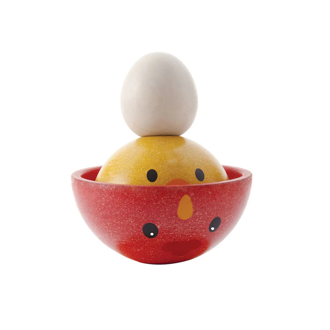 Wooden toy stacker with a chicken design on a white background