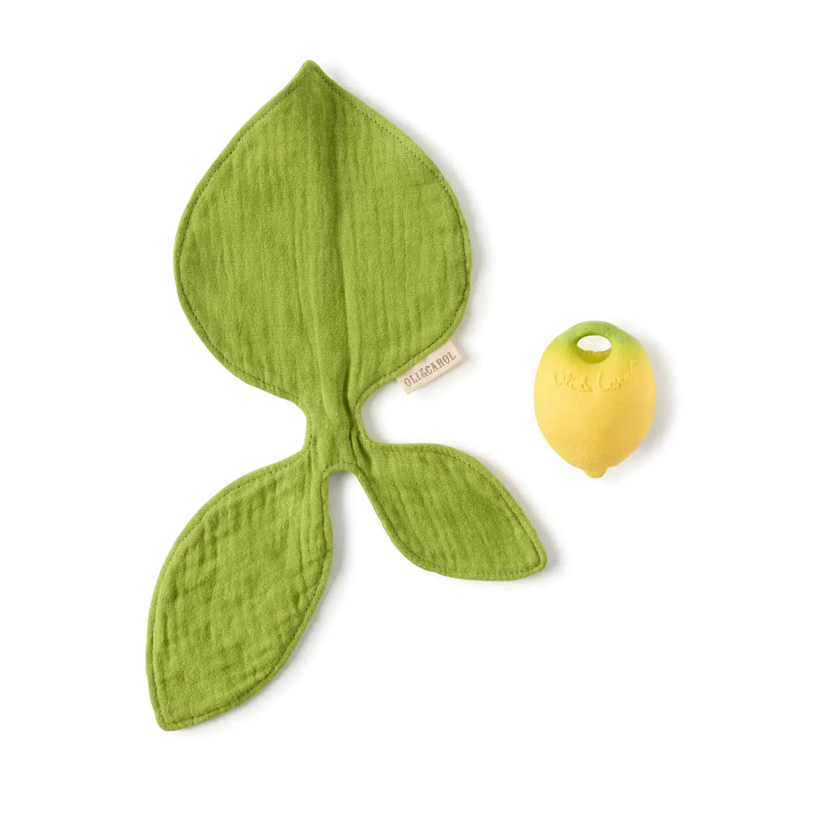 Green leaf-shaped imuslin cloth and yellow teether on a white background