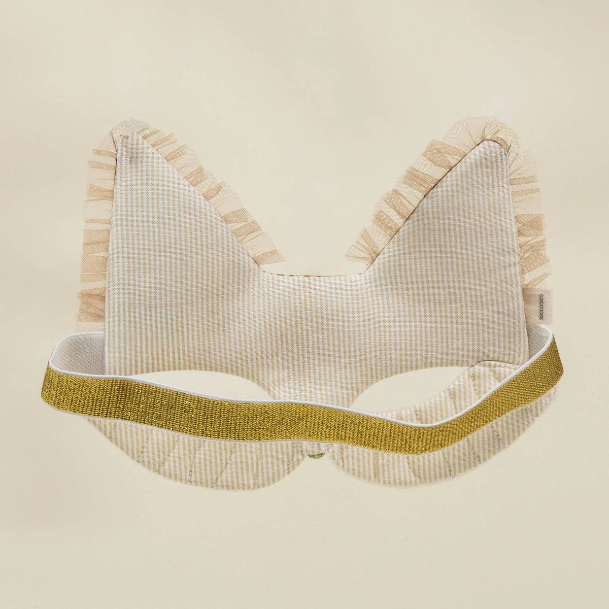 Striped fox mask with gold trim on a beige background