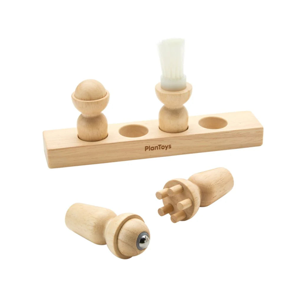 Wooden toy set with cylindrical pieces and a rectangular base on a white background, featuring the PlanToys brand.