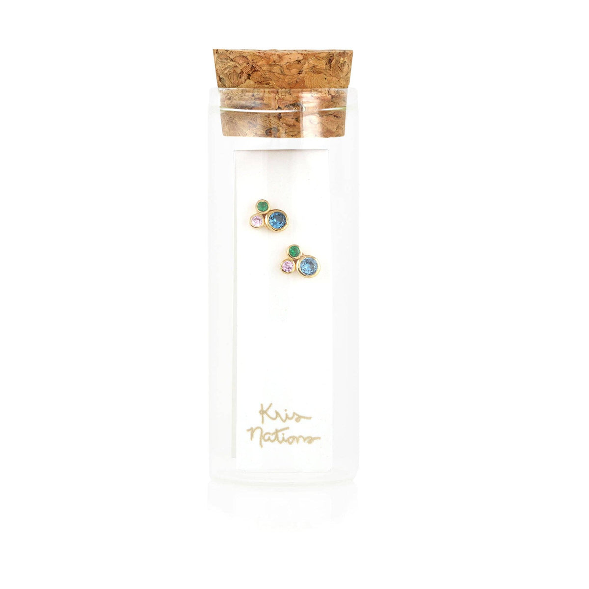 Glass tube with cork top holding a pair of earrings