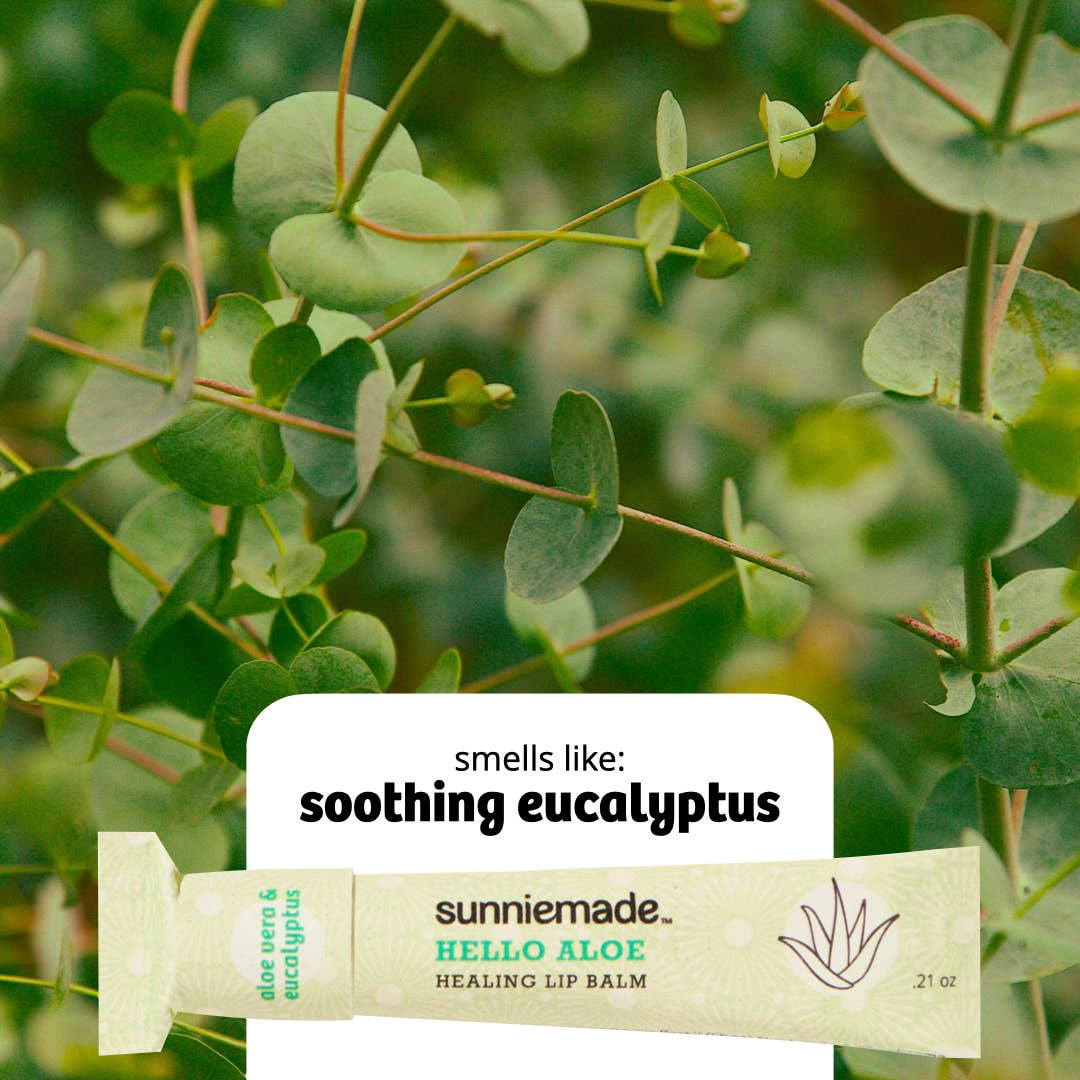 Sunnymade Hello Aloe Healing Lip Balm packaging with eucalyptus leaves in the background
