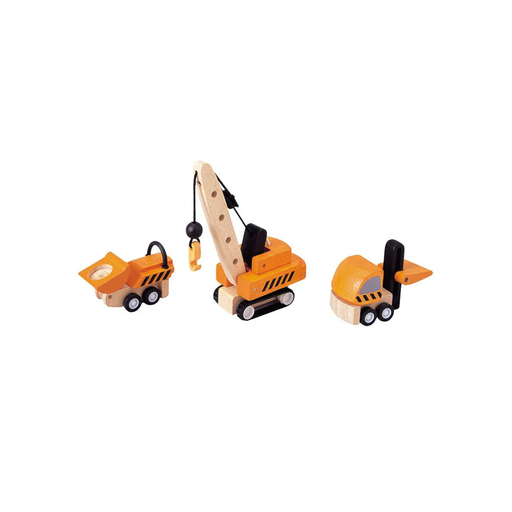 Set of toy construction vehicles including a crane, dump truck, and bulldozer on a white background