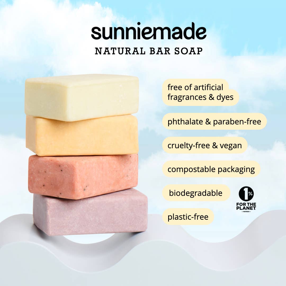 Stack of sunniemade natural bar soaps with product features listed on a light blue background.