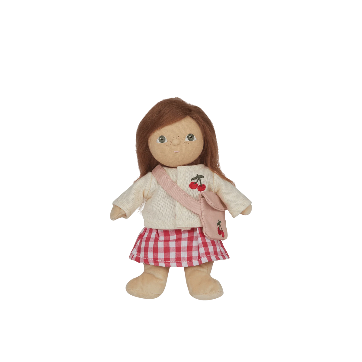 Doll wearing a cream jacket with cherry design and red checkered skirt on a white background