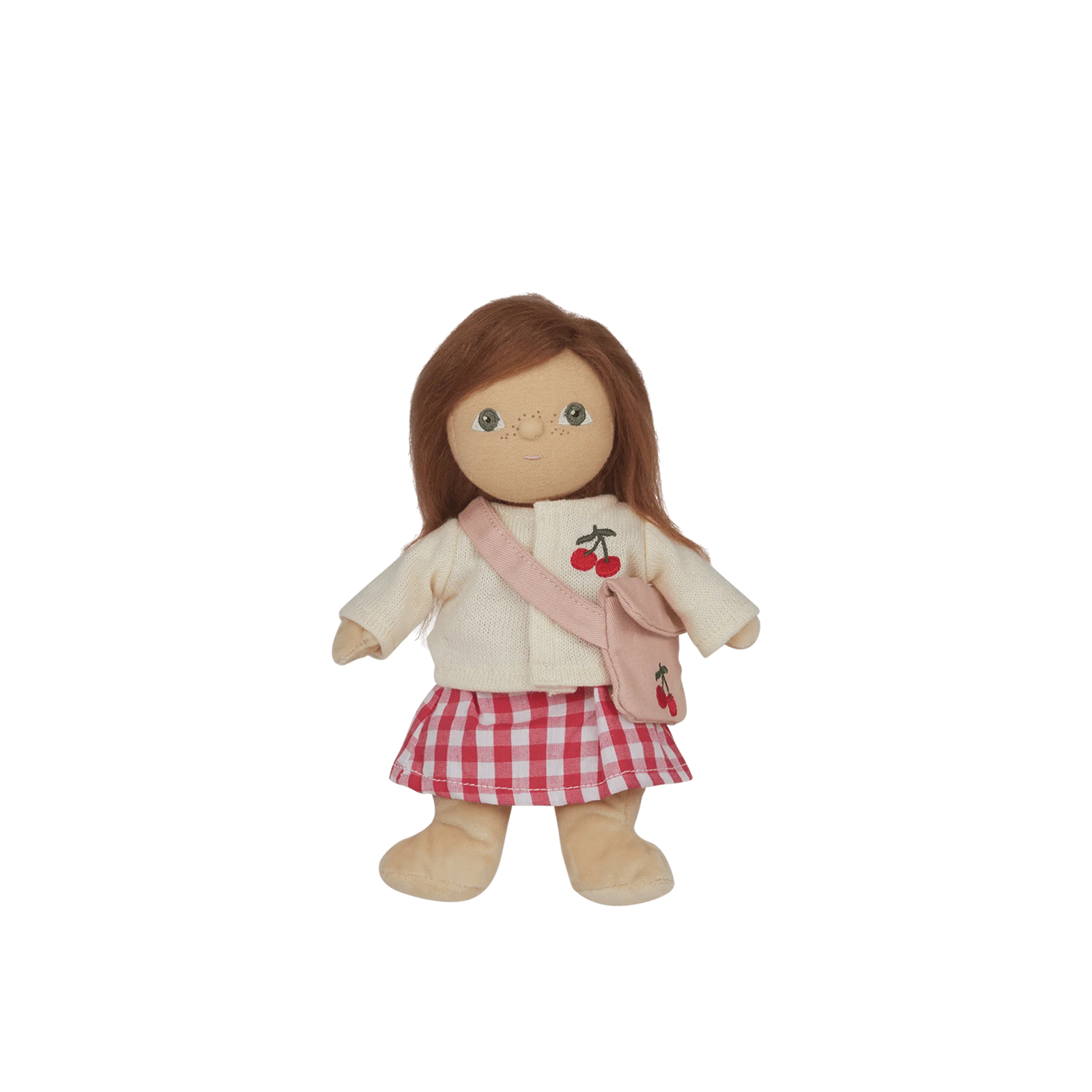 Child holding a doll with a blurred background