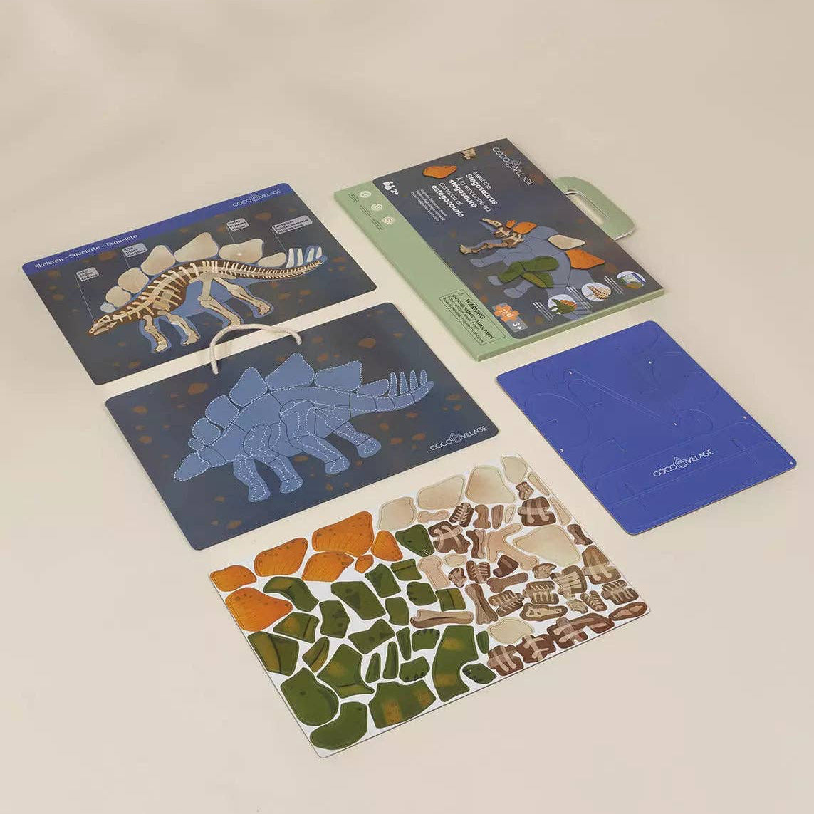 Children's dinosaur puzzle with pieces on a light background
