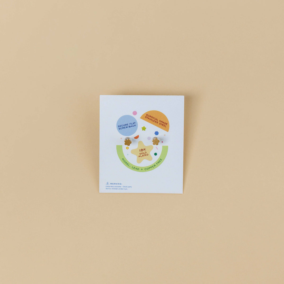 Small white card with colorful graphics on a beige background