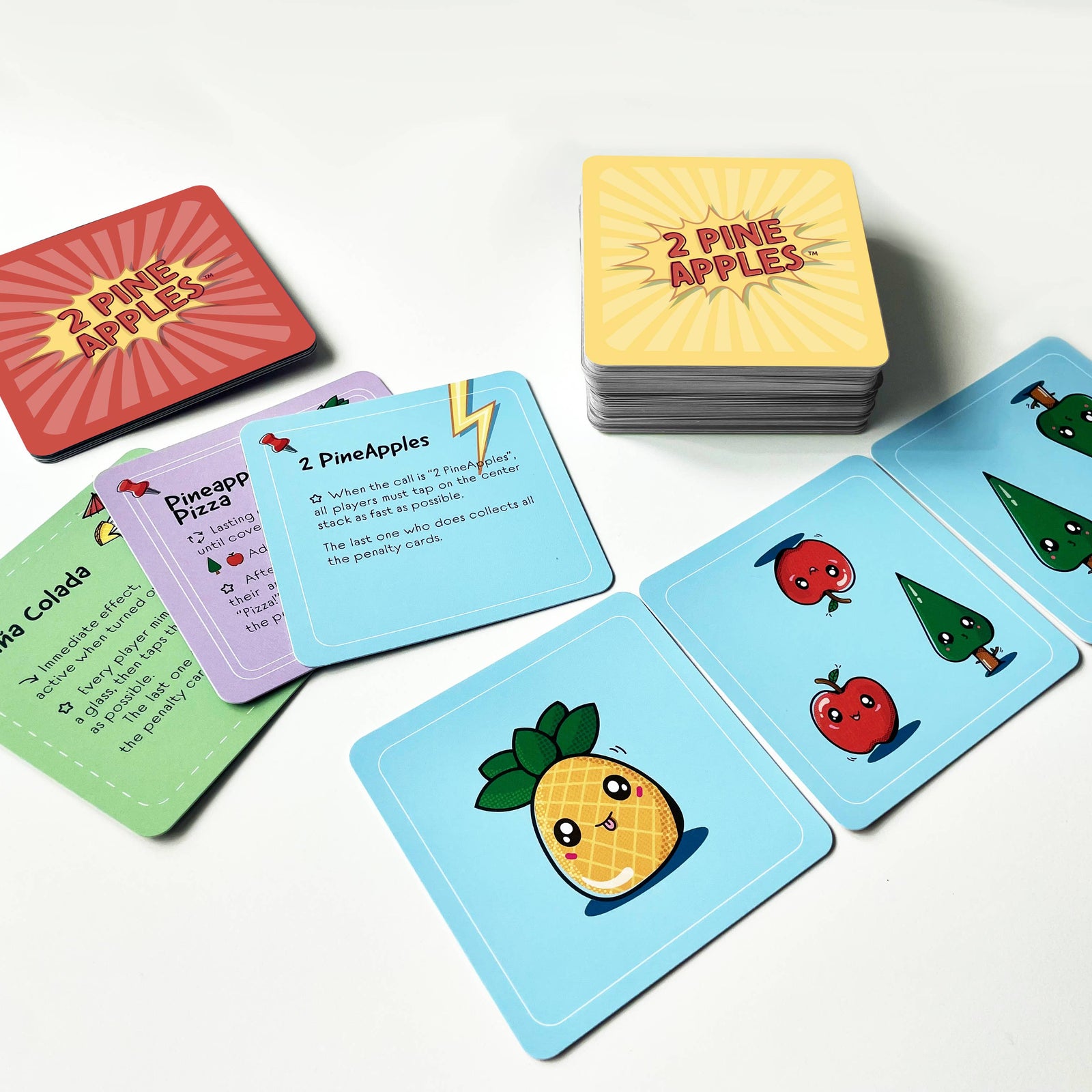 Board game box titled '2 Pine Apples' with cartoon characters on a light gray background