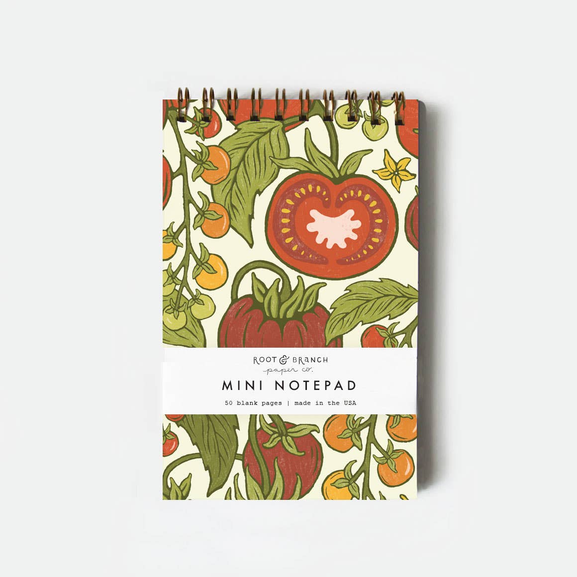 Mini notepad with tomato design on a white background