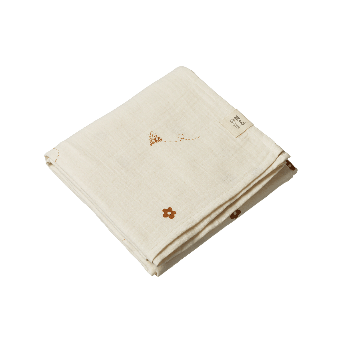 Folded beige fabric with designs on a white background