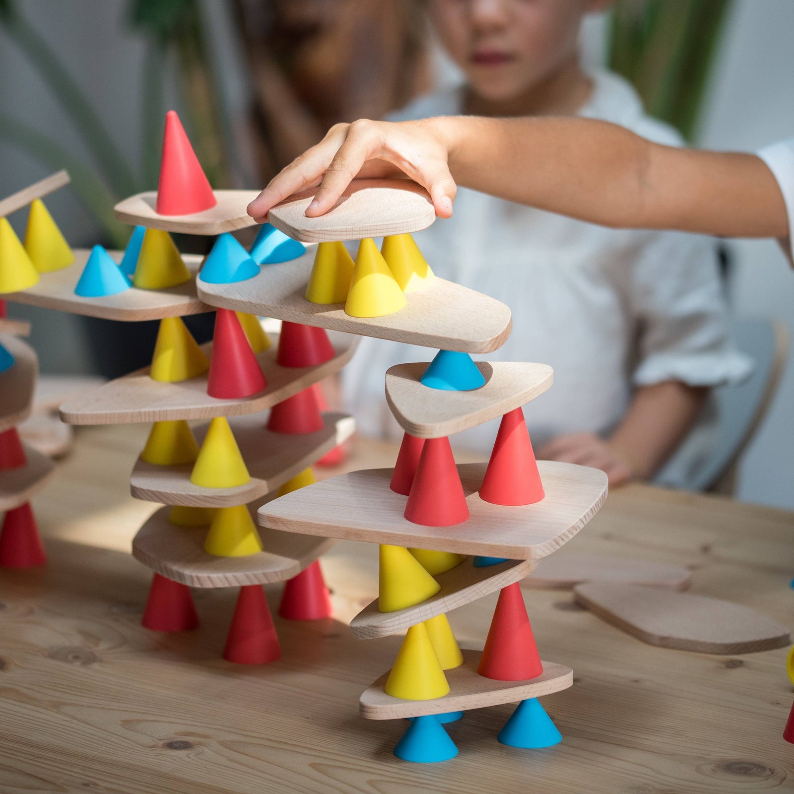 Piks toy packaging with two children playing with colorful geometric shapes on a white background