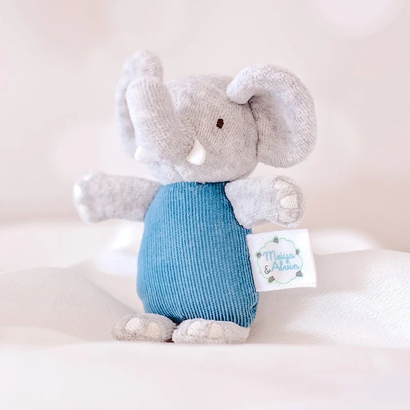Plush elephant toy with a blue bottom and white accents on a light background
