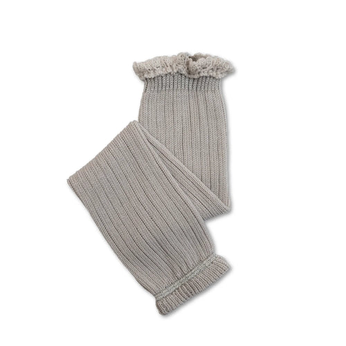 Knitted gray leg warmers with ruffled edge on a white background