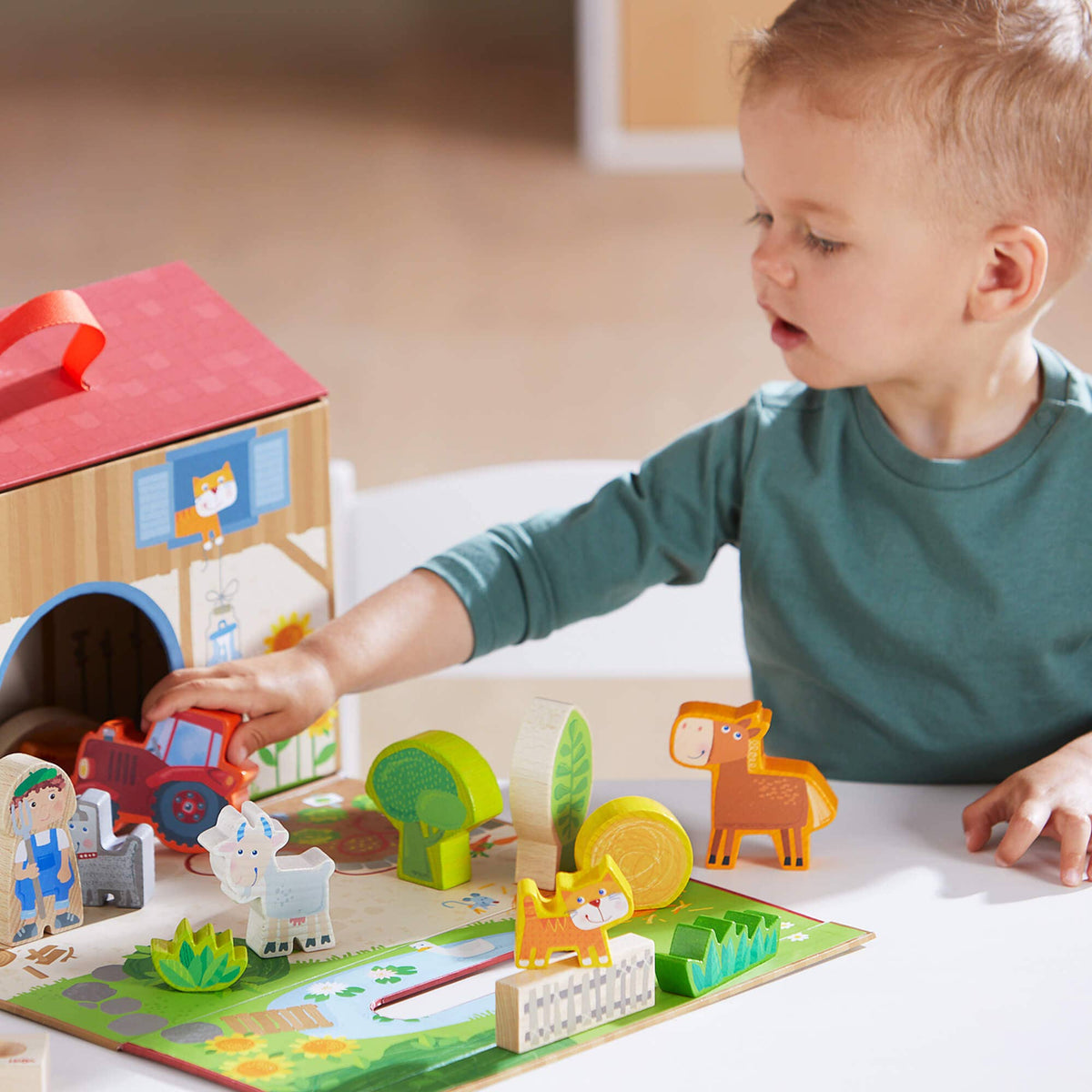 Child playing with a wooden toy set on a table